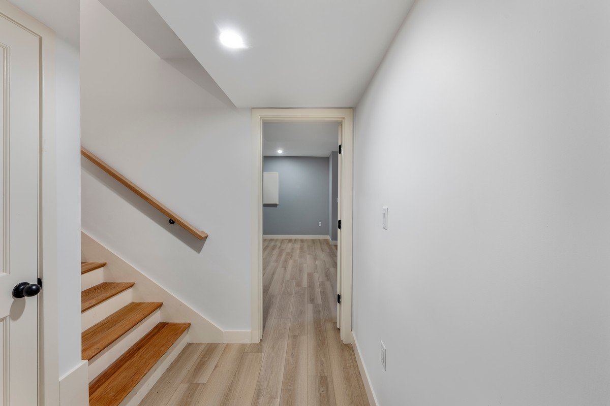 New Construction Duplex in Watertown MA- Lower Level Stairway