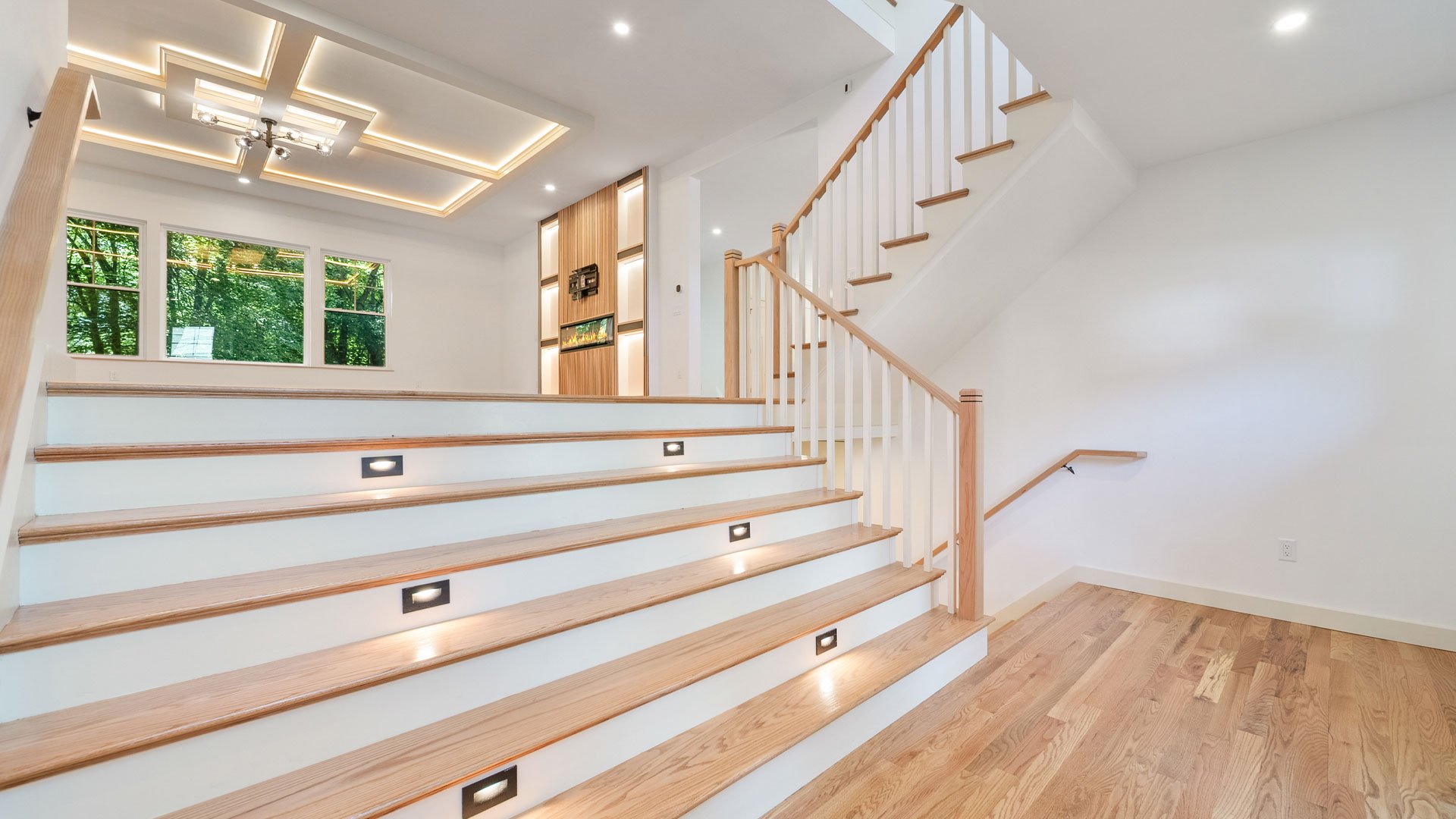 Luxury Home Design Builders MA NH- Large Stariway With Stair Lighting